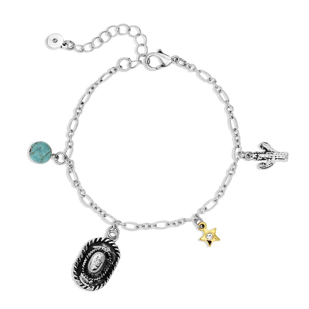 A silver chain charm bracelet featuring a cactus, a gold star, a cowboy hat, and a turquoise bead.
