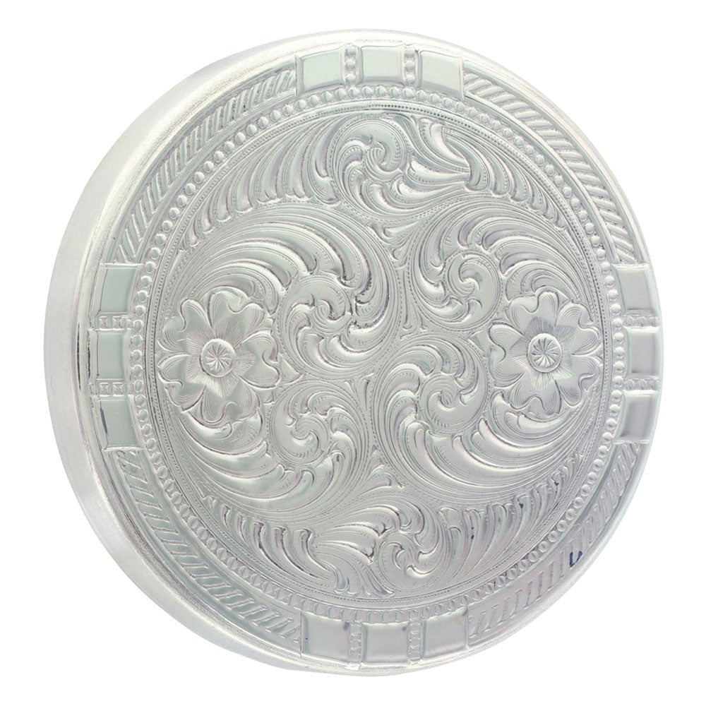 A round, solid German silver snuff lid featuring intricate floral and scrollwork engraving.