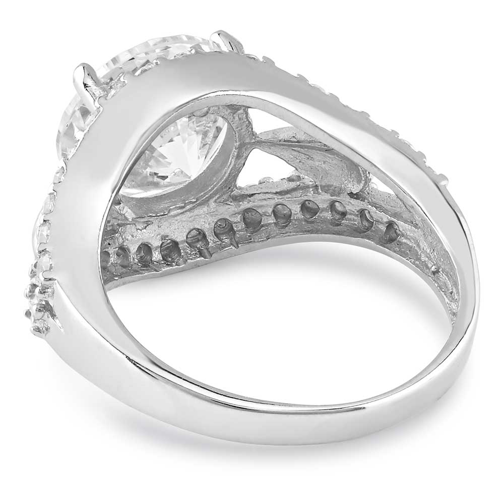 A sterling silver ring featuring a large round cubic zirconia stone flanked by smaller accent stones.