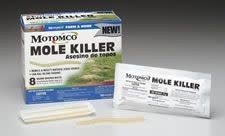 A box of Motomco Mole Killer worm-shaped baits with individual packaging shown in front.