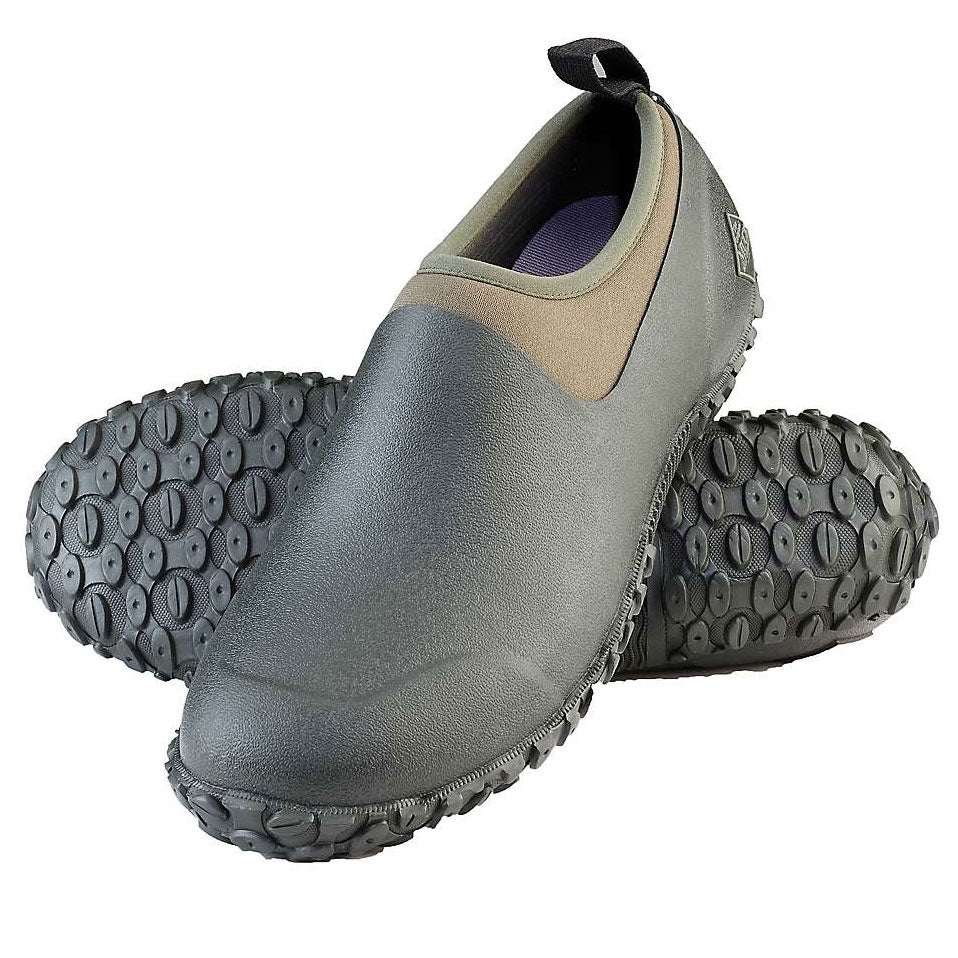 A pair of olive green and black Muckster low-cut slip-on boots with rugged rubber outsoles.