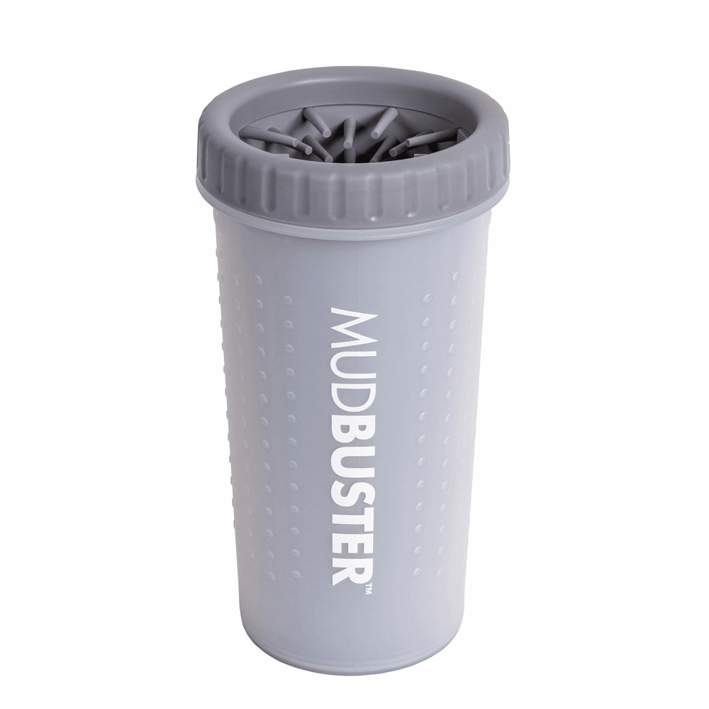 A grey portable dog paw cleaner with internal silicone bristles in a tumbler design.