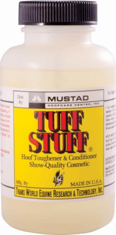 A bottle of Mustad Tuff Stuff hoof toughener and conditioner with a black cap.