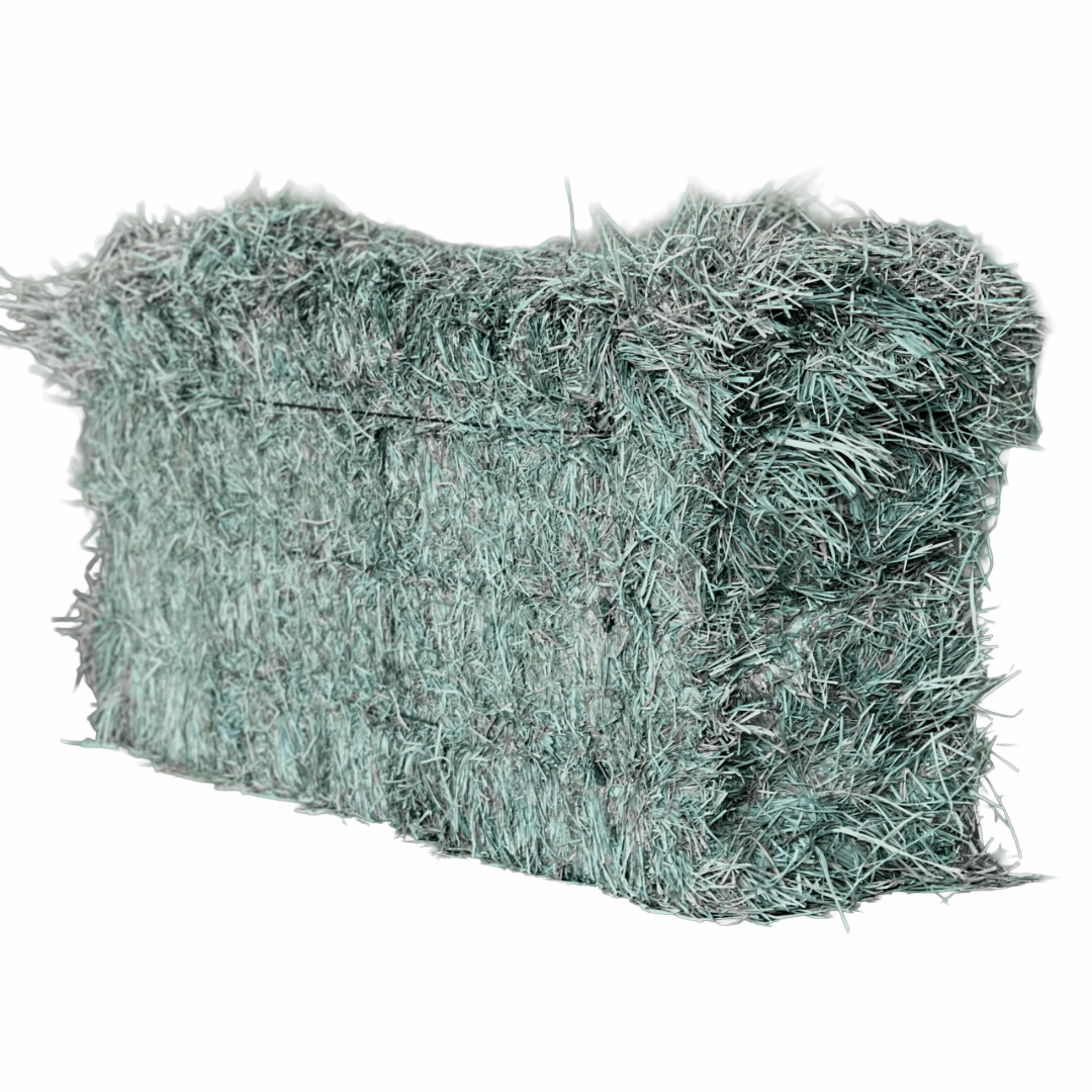 A rectangular bale of dried orchard grass with a textured, fibrous surface.