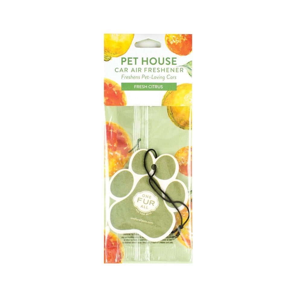 A paw-shaped green car air freshener in a citrus-themed package.