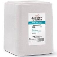 A 50-pound block of white salt for livestock with a product label on the front.