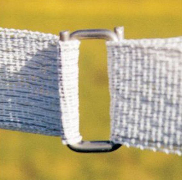 A stainless steel splice buckle connecting two ends of white electric fence tape.