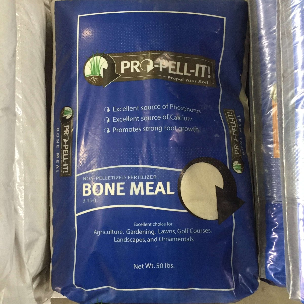 A 50-pound bag of Pro-Pell-It bone meal fertilizer with a 3-15-0 nutrient analysis.