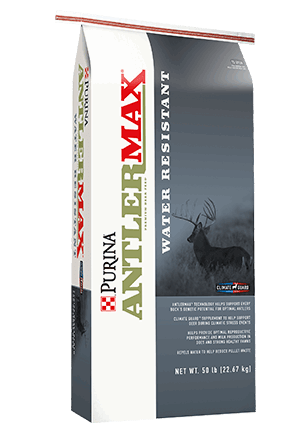 A fifty-pound bag of Purina Antlermax water-resistant deer feed featuring a buck on the front.