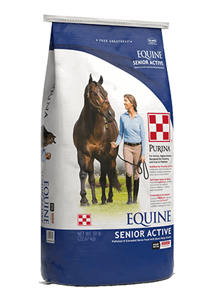 A 50-pound bag of Purina Equine Senior Active horse feed featuring a woman leading a horse.