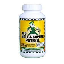 A white plastic bottle of RCO Mole and Gopher Patrol bait with a yellow label and cartoon mascot.