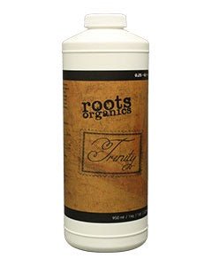 A white plastic bottle of Roots Organics Trinity plant supplement with a tan label.