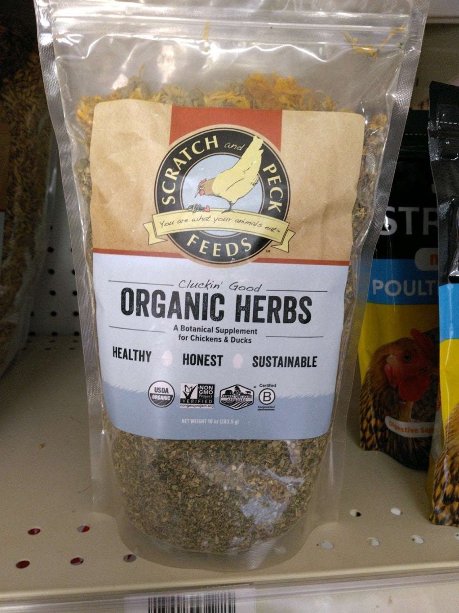 A clear plastic bag of Scratch and Peck organic herb supplement for chickens and ducks.