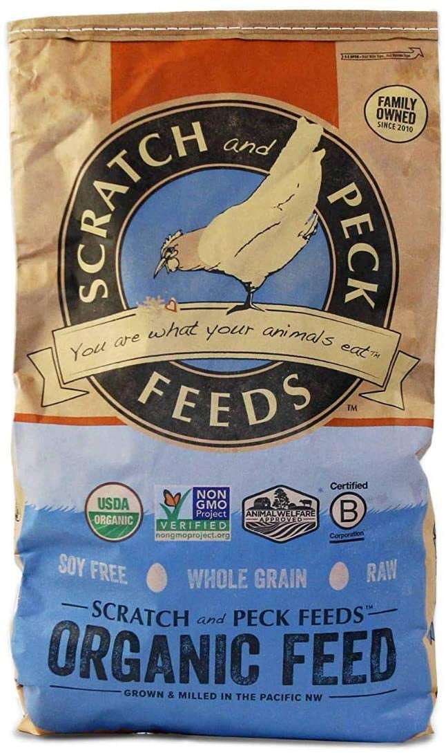 A bag of Scratch and Peck Naturally Free organic layer feed with a chicken illustration.