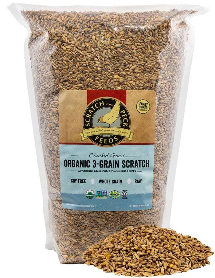 A clear plastic bag of Scratch and Peck organic 3-grain scratch feed for chickens and ducks.