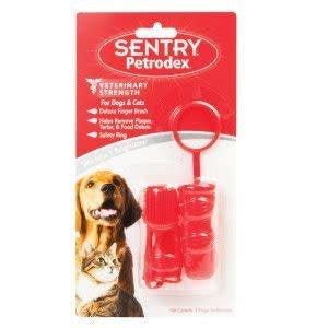 Two red Sentry Petrodex finger toothbrushes with a safety ring in their original packaging.