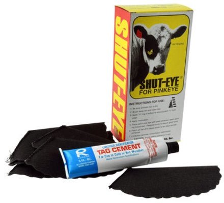 A Shut Eye patch kit containing a box of ten canvas eye patches and a tube of tag cement.
