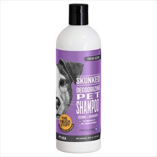 A 16-ounce bottle of Skunked! deodorizing pet shampoo with a purple label featuring a dog.