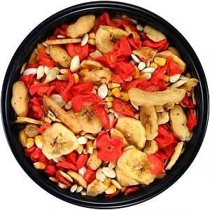 A black bowl filled with a colorful mix of dried fruit, vegetables, and seeds for small animals.