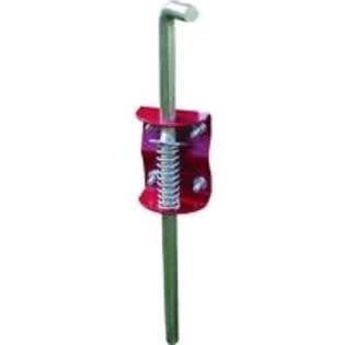 A SpeeCo gate anchor featuring a spring-loaded metal rod and a red mounting bracket.