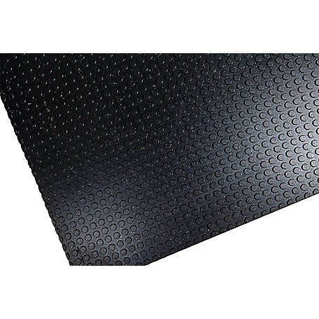 A black rubber stall mat featuring a textured, circular anti-skid surface pattern.