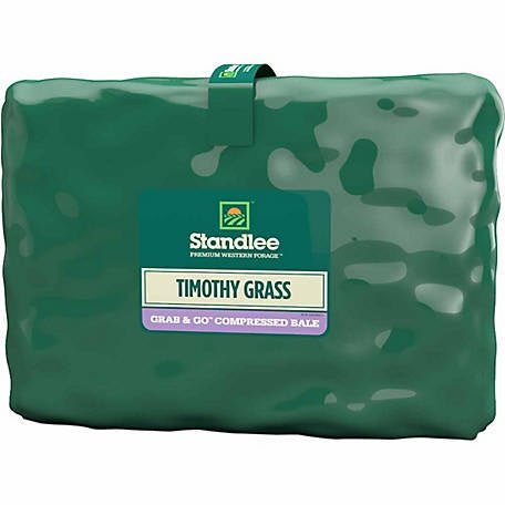 A rectangular, shrink-wrapped bale of Standlee Timothy Grass forage in green packaging.