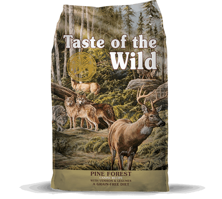 A bag of Taste of the Wild Pine Forest dog food featuring a forest scene with deer and wolves.