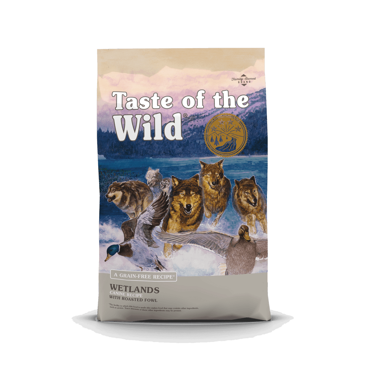 A bag of Taste of the Wild Wetlands dog food featuring an illustration of wolves and ducks.