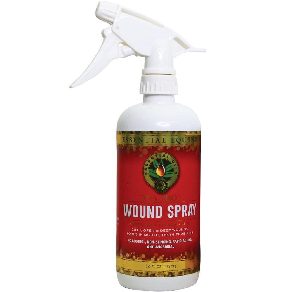 A white spray bottle of Tea Tree Equine Wound Spray with a red label and trigger nozzle.