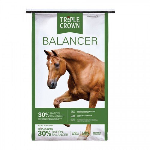 A fifty-pound bag of Triple Crown 30% Ration Balancer featuring a brown horse on the front.