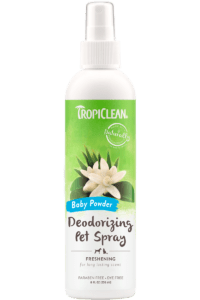 A white spray bottle of Tropiclean Baby Powder deodorizing pet spray with a green label.