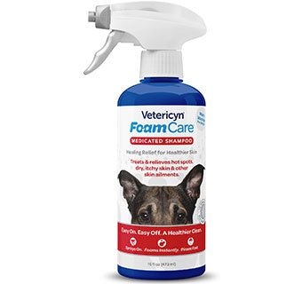 A 16-ounce spray bottle of Vetericyn Foam Care medicated shampoo featuring a dog on the label.