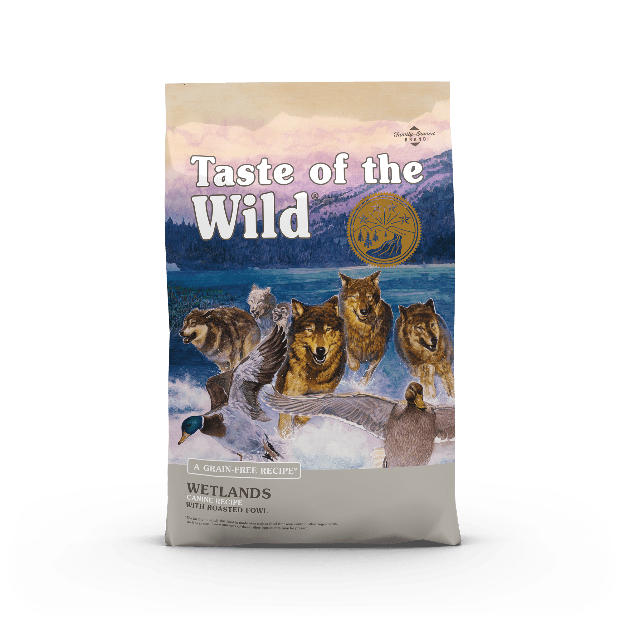 A bag of Taste of the Wild Wetlands dog food featuring an illustration of wolves and ducks.